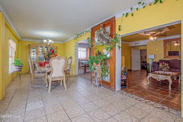 dining area featuring ceiling fan with notable chandelier and ornamental molding