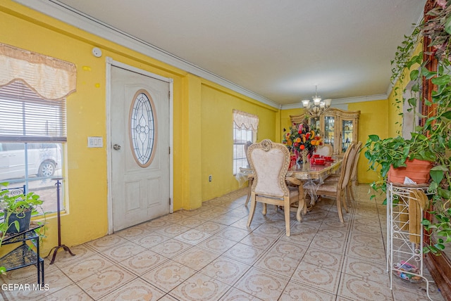 tiled dining area with ornamental molding and an inviting chandelier