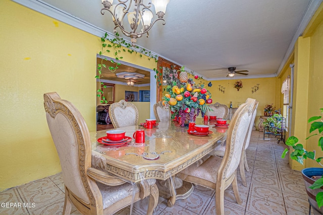 dining room featuring ceiling fan with notable chandelier and ornamental molding