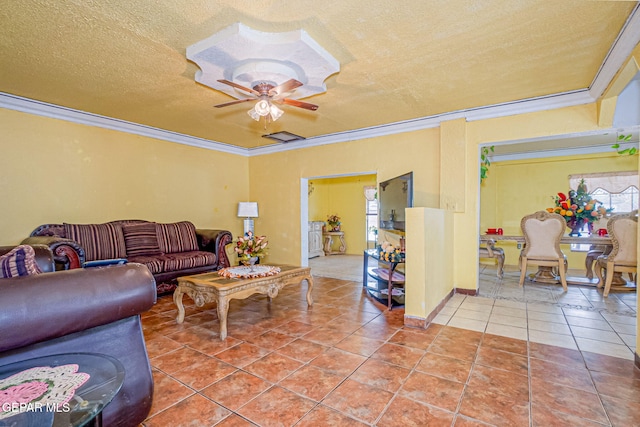 tiled living room featuring a textured ceiling, ceiling fan, and crown molding