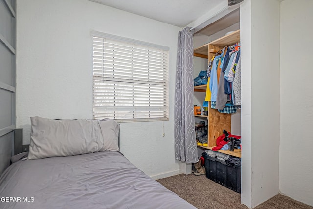 carpeted bedroom featuring a closet