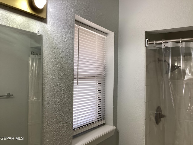 bathroom featuring a shower with curtain