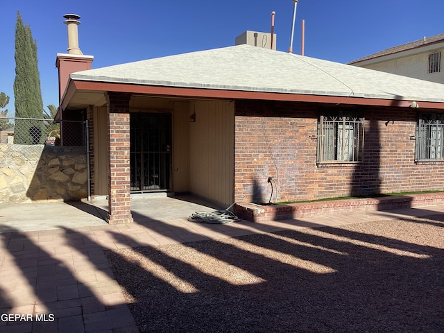 back of property with a patio