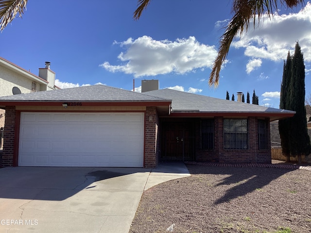 single story home featuring a garage