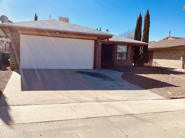 ranch-style house featuring a garage