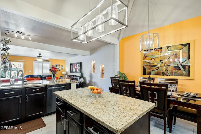 kitchen with ceiling fan, sink, light tile patterned floors, dishwasher, and a kitchen island