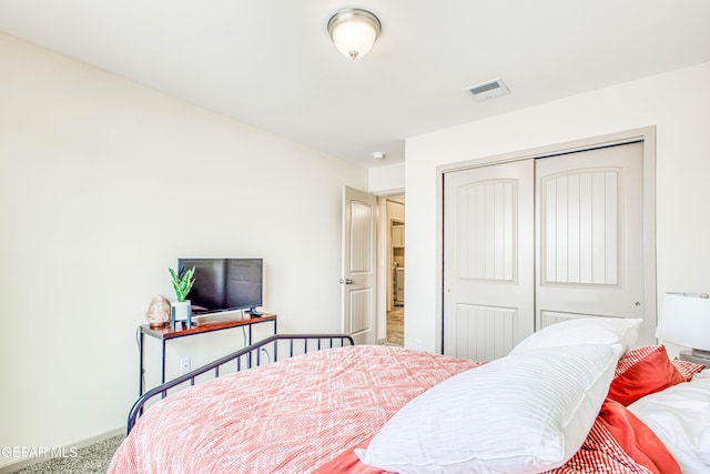 carpeted bedroom with a closet