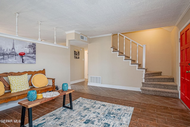 living room featuring a textured ceiling and ornamental molding