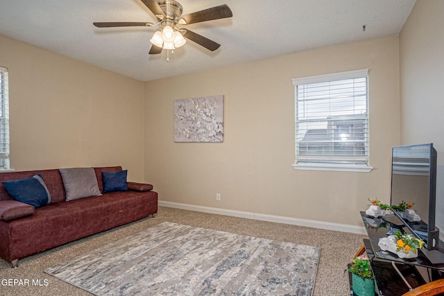 living room with ceiling fan and carpet floors