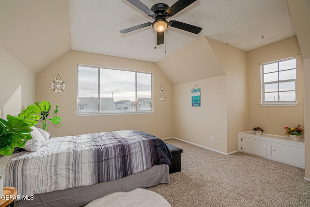 bedroom featuring ceiling fan, light carpet, and lofted ceiling