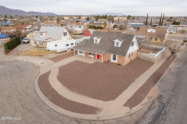 birds eye view of property with a mountain view