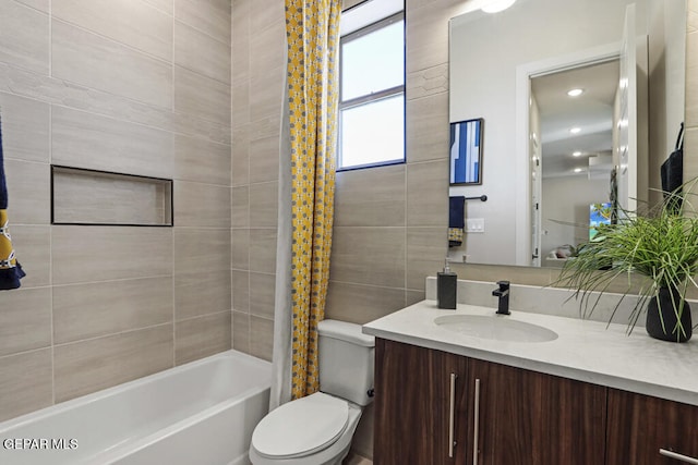 full bathroom featuring shower / bath combination with curtain, vanity, and toilet