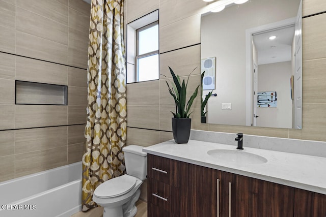 full bathroom with vanity, toilet, and shower / bath combo with shower curtain