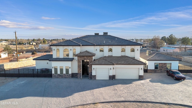 mediterranean / spanish house with a garage