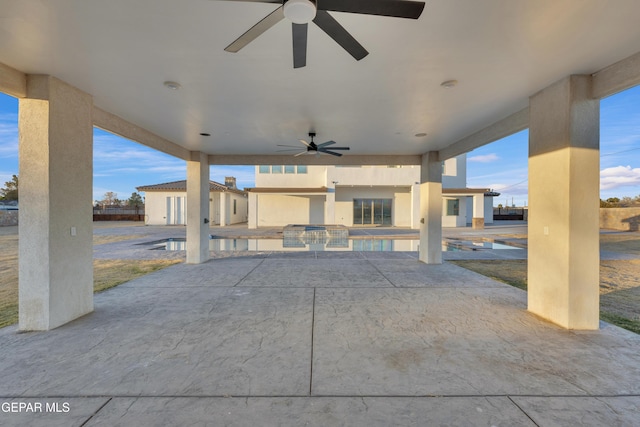 view of patio featuring ceiling fan