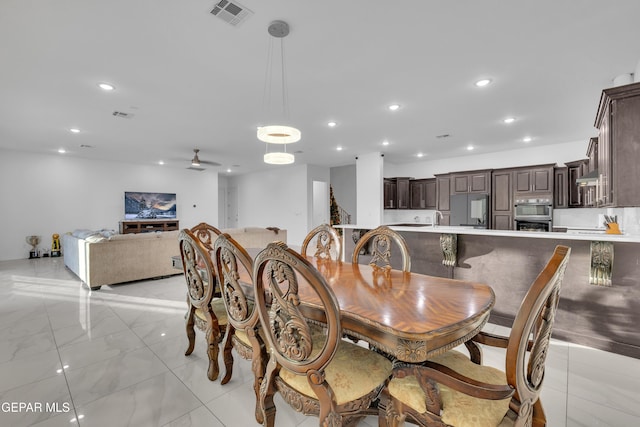 dining room featuring ceiling fan