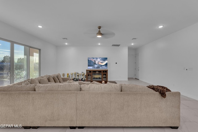 living room featuring light tile patterned flooring and ceiling fan