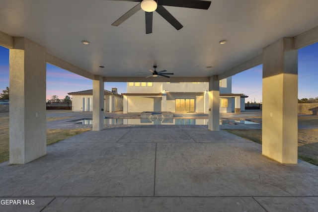 patio terrace at dusk with ceiling fan