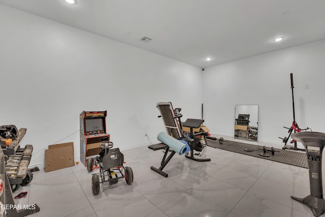 workout area with light tile patterned floors