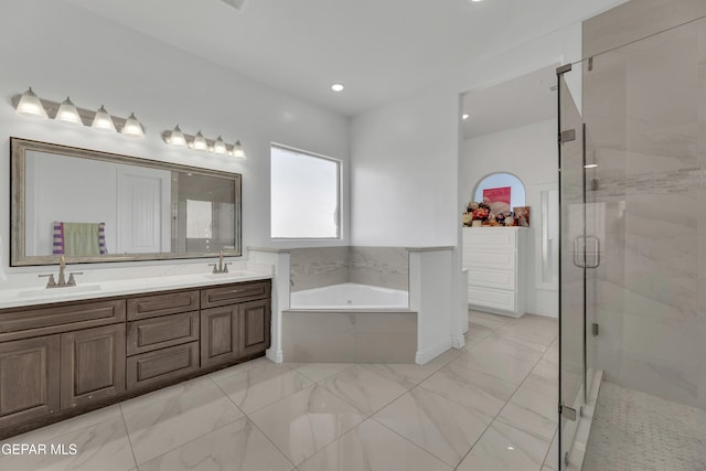 bathroom featuring vanity and separate shower and tub