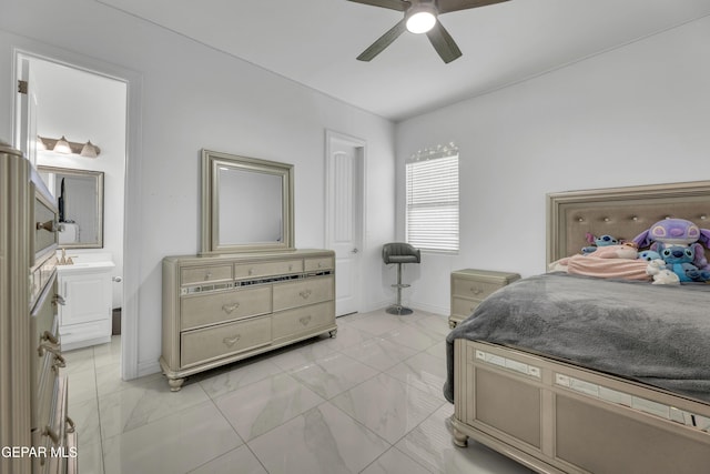 bedroom featuring ceiling fan and ensuite bath