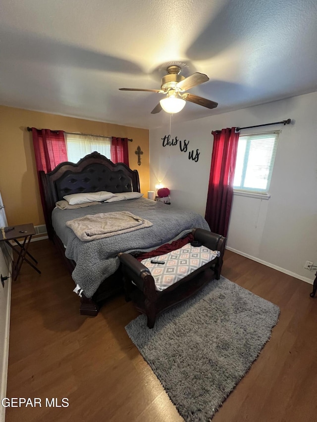 bedroom featuring ceiling fan and wood-type flooring