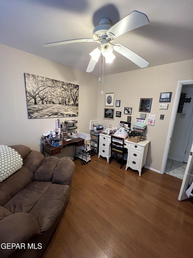 office featuring ceiling fan and dark wood-type flooring