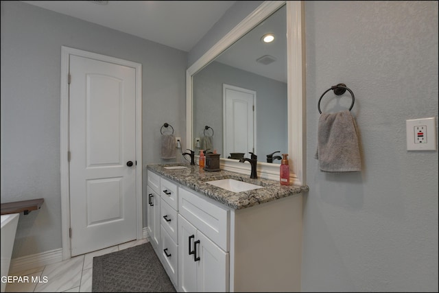 bathroom featuring tile patterned floors and vanity