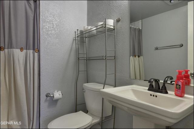 bathroom with sink and toilet