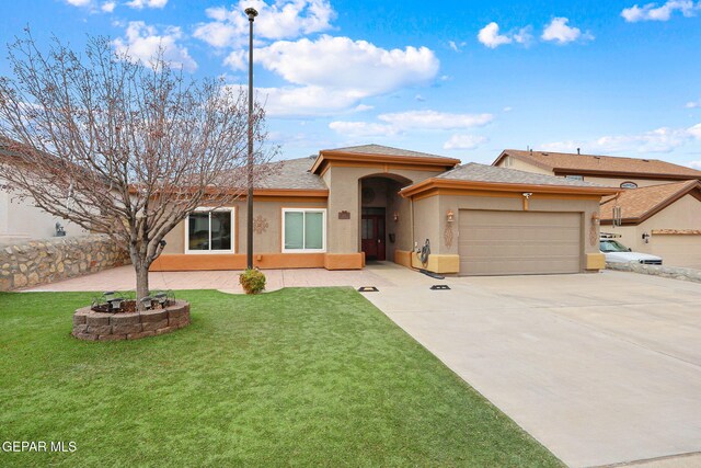 view of front of house with a front yard and a garage