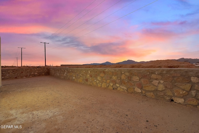 yard at dusk with a mountain view