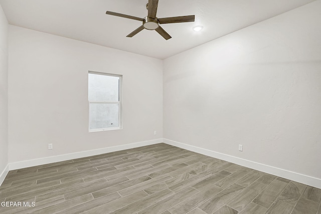 unfurnished room with ceiling fan and light hardwood / wood-style flooring