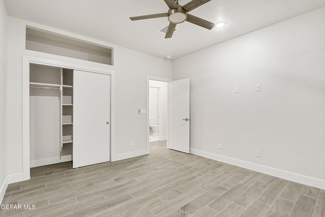 unfurnished bedroom featuring a closet, light hardwood / wood-style flooring, and ceiling fan