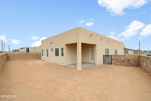 back of house featuring a patio area