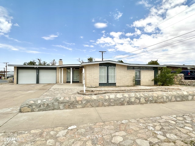 single story home featuring a garage