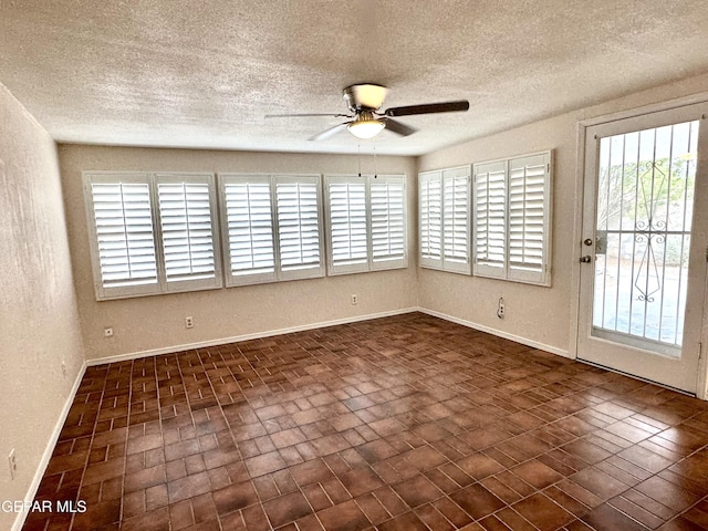 unfurnished room with ceiling fan