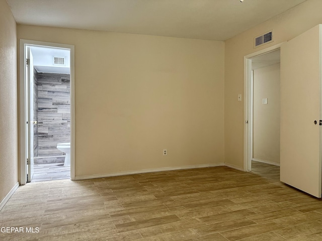 unfurnished room with light hardwood / wood-style floors