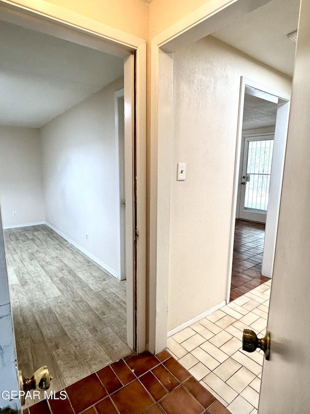 corridor with tile patterned floors