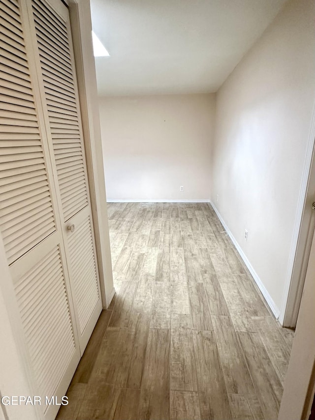 hall with light hardwood / wood-style flooring