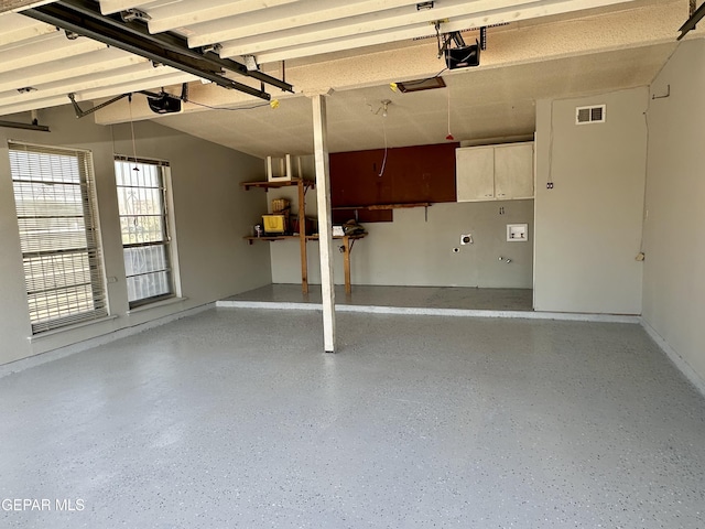 garage featuring a garage door opener