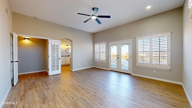 unfurnished bedroom with ensuite bath, ceiling fan, french doors, light hardwood / wood-style flooring, and access to outside