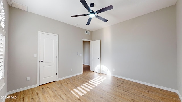 unfurnished bedroom featuring ceiling fan and light wood-type flooring