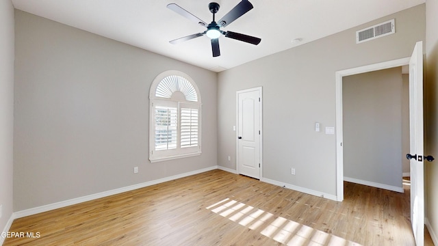 unfurnished bedroom with ceiling fan, a closet, and light hardwood / wood-style floors