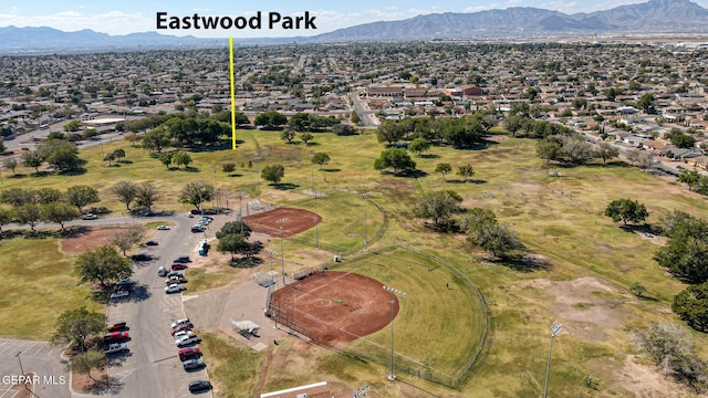 birds eye view of property with a mountain view