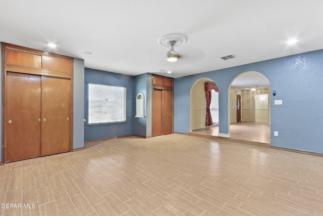 interior space with ceiling fan and light hardwood / wood-style floors