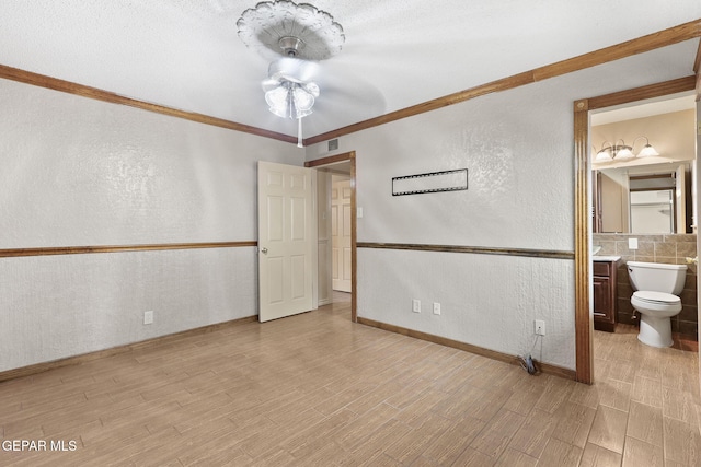 spare room featuring crown molding