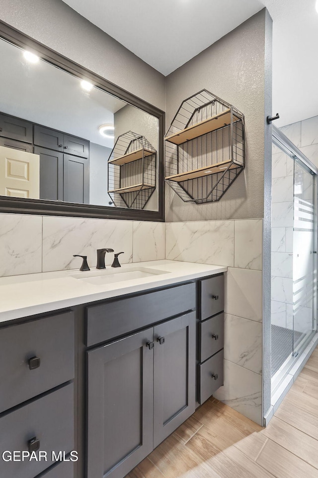 bathroom with vanity and walk in shower