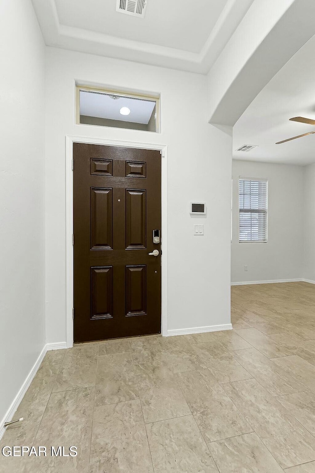 foyer featuring ceiling fan