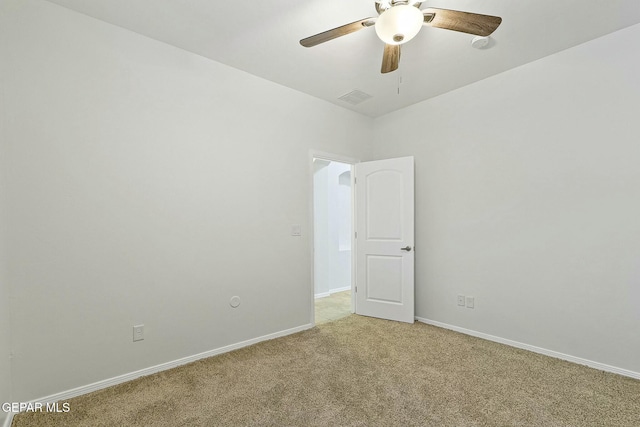 carpeted empty room with ceiling fan