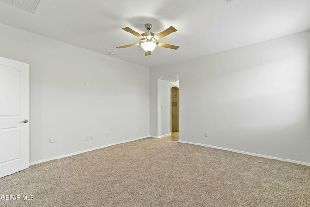 carpeted empty room featuring ceiling fan